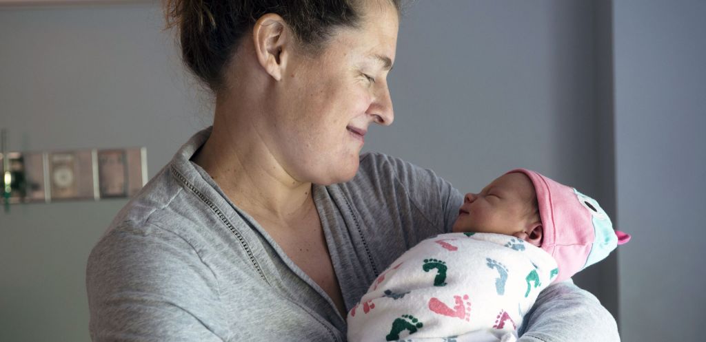 Proud mother holds her newborn child at Cooley Dickinson Hospital Childbirth Center, 30 Locust Street, Northampton, MA 01060.