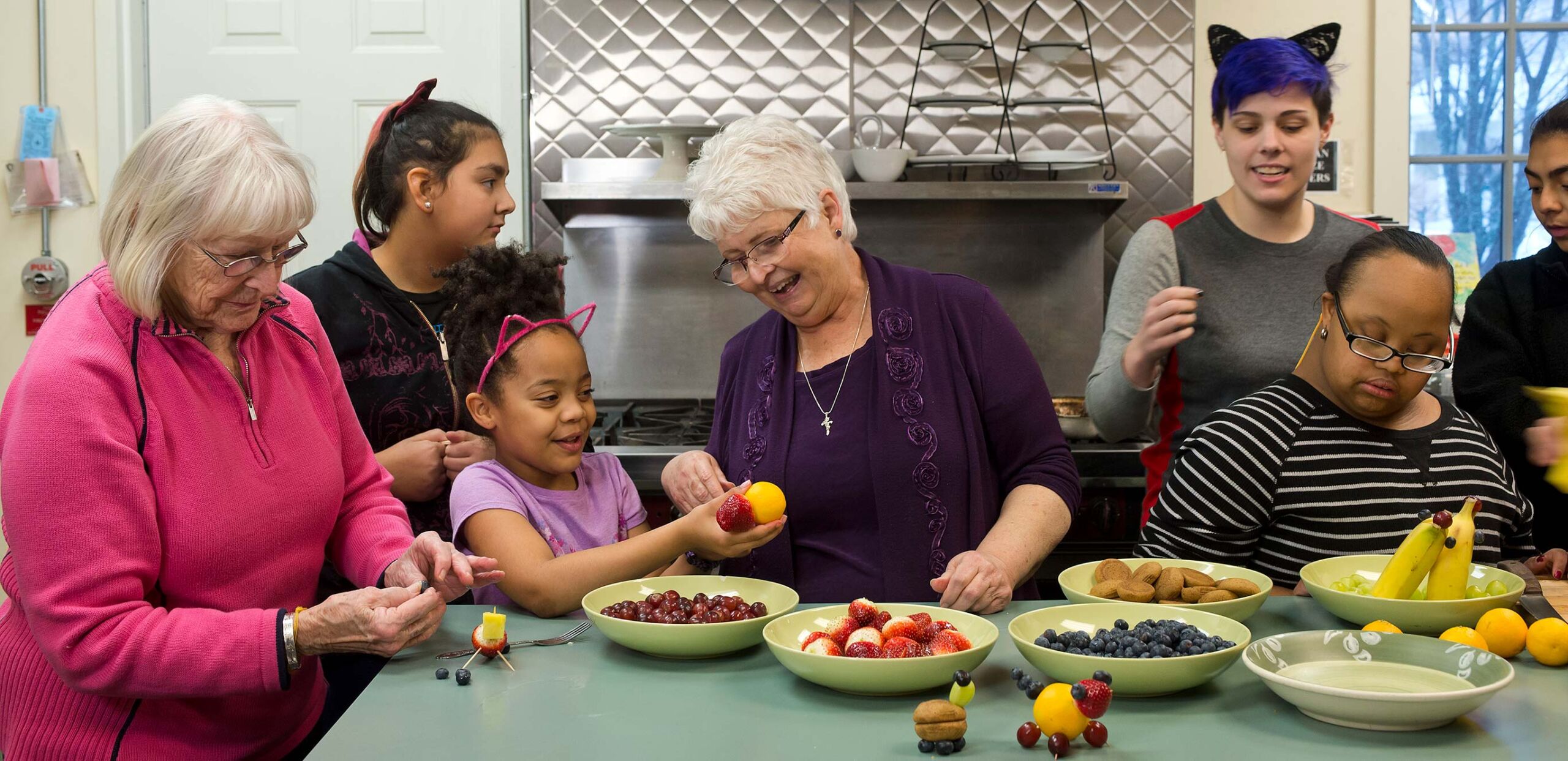 Women and girls make animals figures from fresh fruit, Community Partners initiative, Cooley Dickinson Hospital, 30 Locust Street, Northampton, MA 01060.