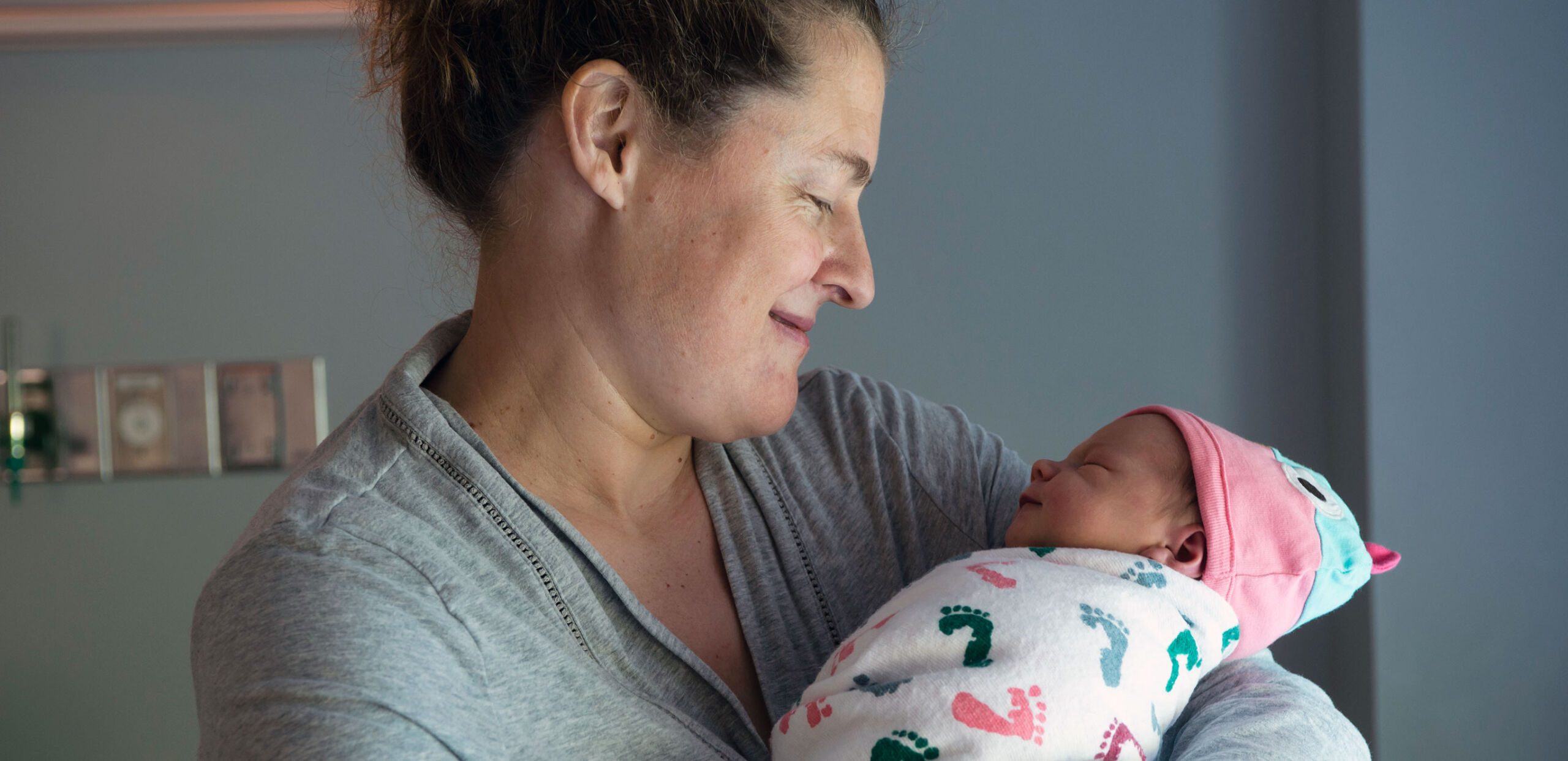Proud mother holds newborn baby in the Childbirth Center at Cooley Dickinson Hospital, 30 Locust Street, Northampton, MA 01060.