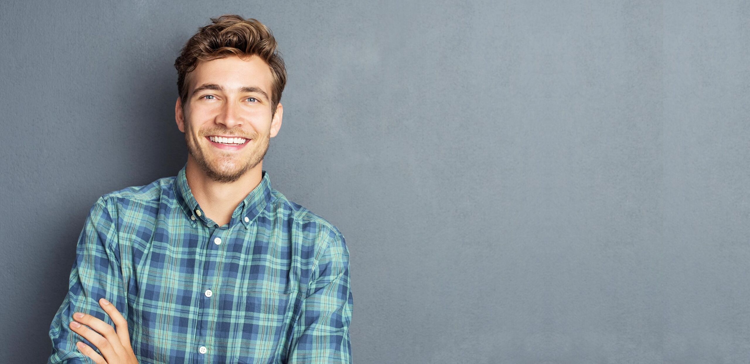 Smiling young man, Cooley Dickinson Medical Group Plastic Surgery, Florence, MA 01062.