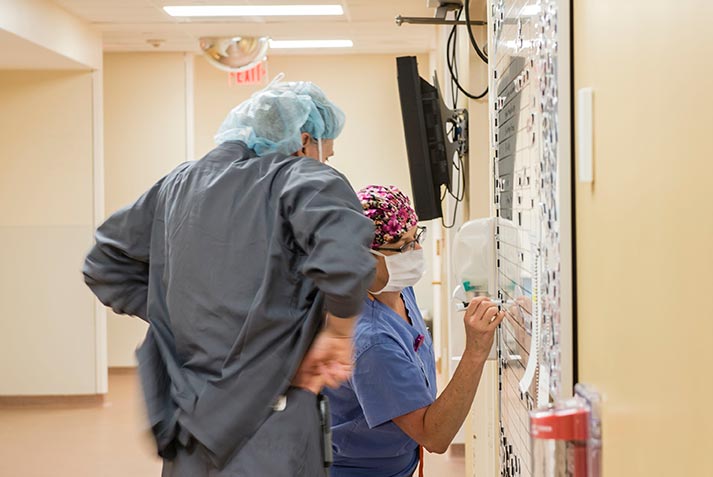 Doctor and nurse review patient status at the Kittredge Surgery Center, Cooley Dickinson Hospital, 30 Locust Street, Northampton, MA 01060.