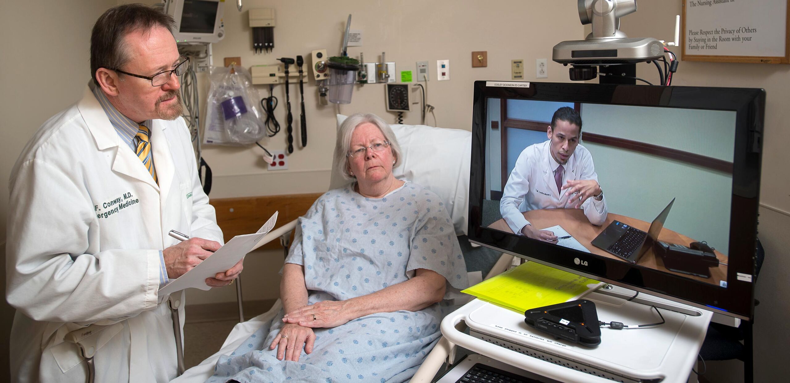 R. F. Conway, MD, and patient use Telehealth system to confer with MGH specialist.