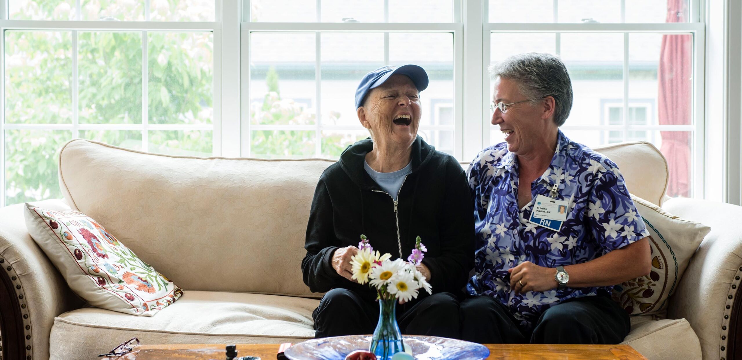 Visiting nurse shares a joke with patient in her home, Cooley Dickinson Medical Group VNA and Hospice, Northampton, MA 01060.