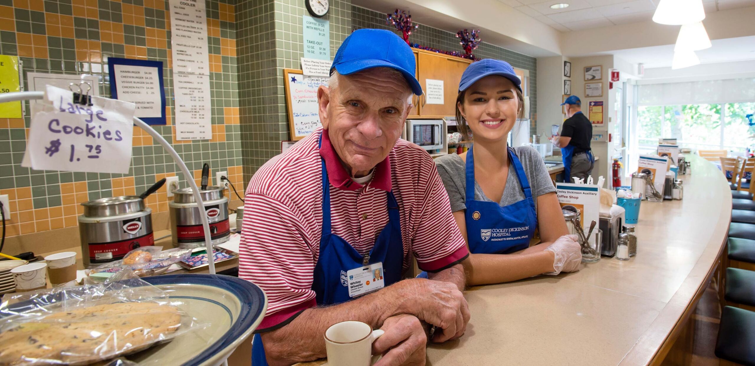 Volunteer workers greet customers in the cafe at at Cooley Dickinson Hospital, 30 Locust Street, Northampton, MA 01060.