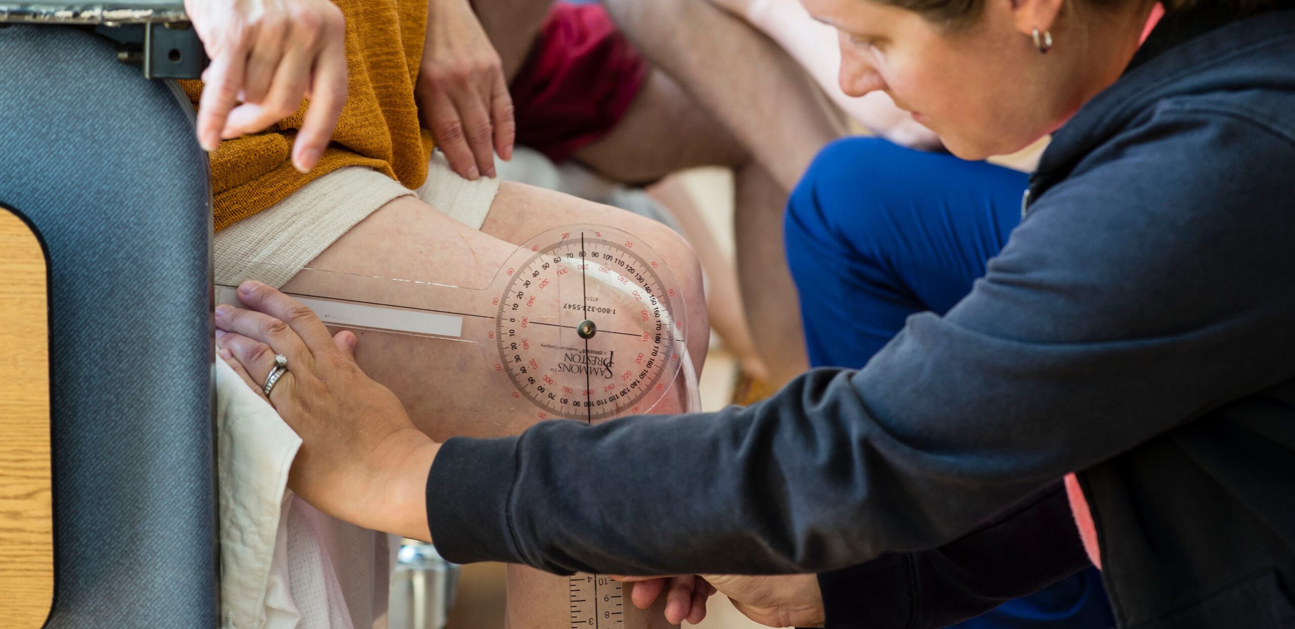 Provider measures patient's knee range of motion in the Joint Replacement Center at Cooley Dickinson Hospital, Northampton, MA 01060