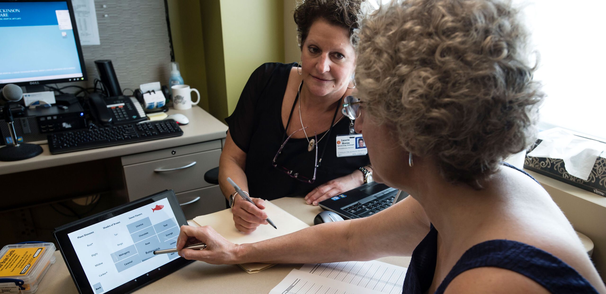 Speech therapist Laurie Korza works with a patient as she practices saying specified words at Cooley Dickinson Rehabilitation Services, Northampton, MA 01060.