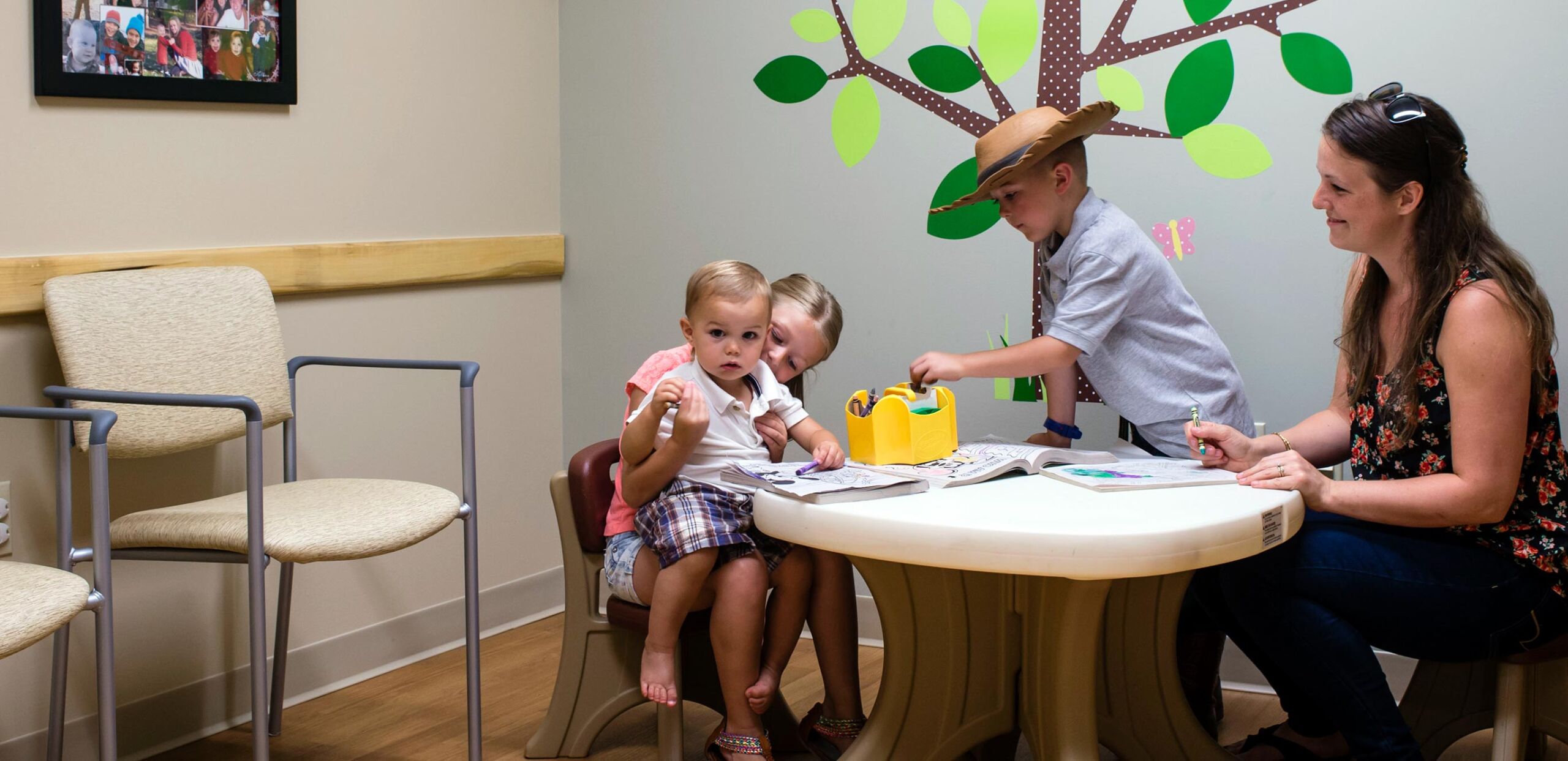 Mothers play with their children in children's area of waiting room at South Deerfield Family Medicine and Sugarloaf Pediatrics, 29 Elm Street, South Deerfield, MA 01373.