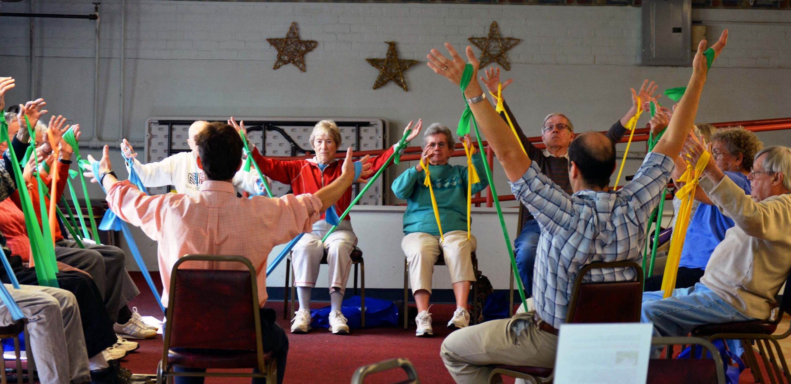 Seniors use stretch bands in an exercise class, Cooley Dickinson Medical Group VNA & Hospice, Northampton, MA 01060.