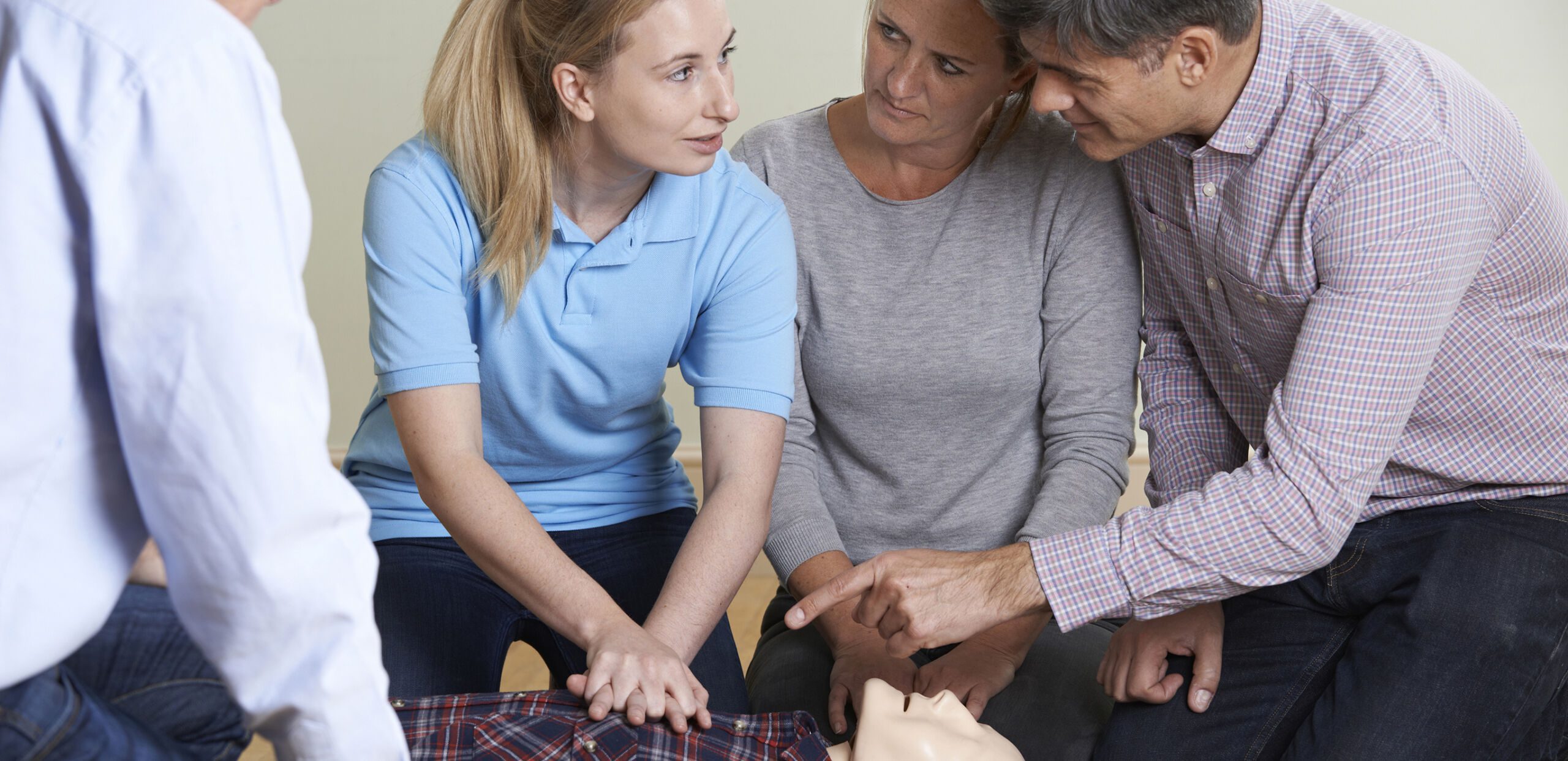 Female instructor demonstrating CPR on training dummy in Basic Life Support class, Cooley Dickinson Hospital, 30 Locust Street, Northampton, MA 01060.