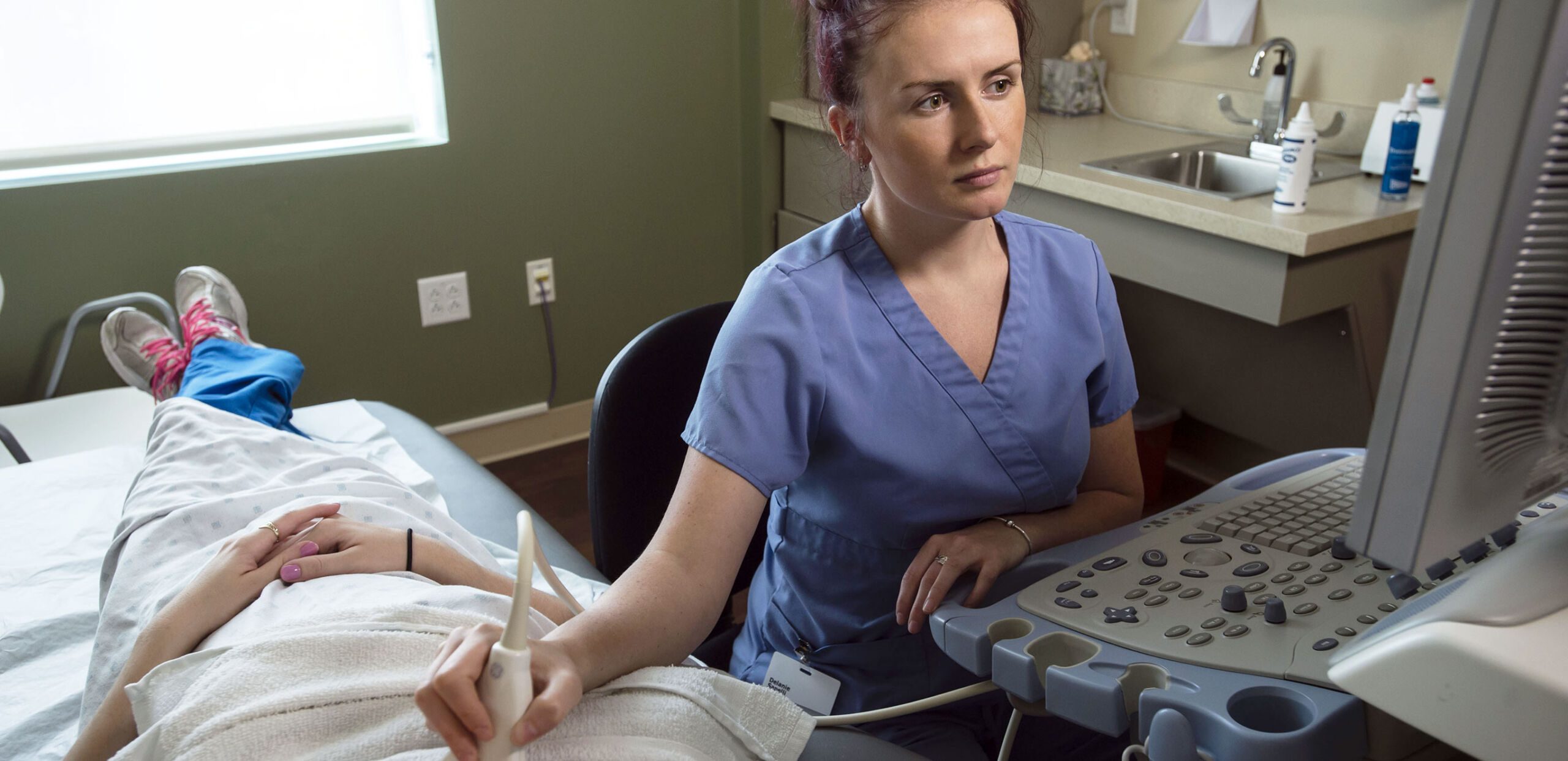 Ultrasound technician administering cardiac test to patient, Cooley Dickinson Medical Group Hampshire Cardiovascular Associates, Northampton, MA 01060.