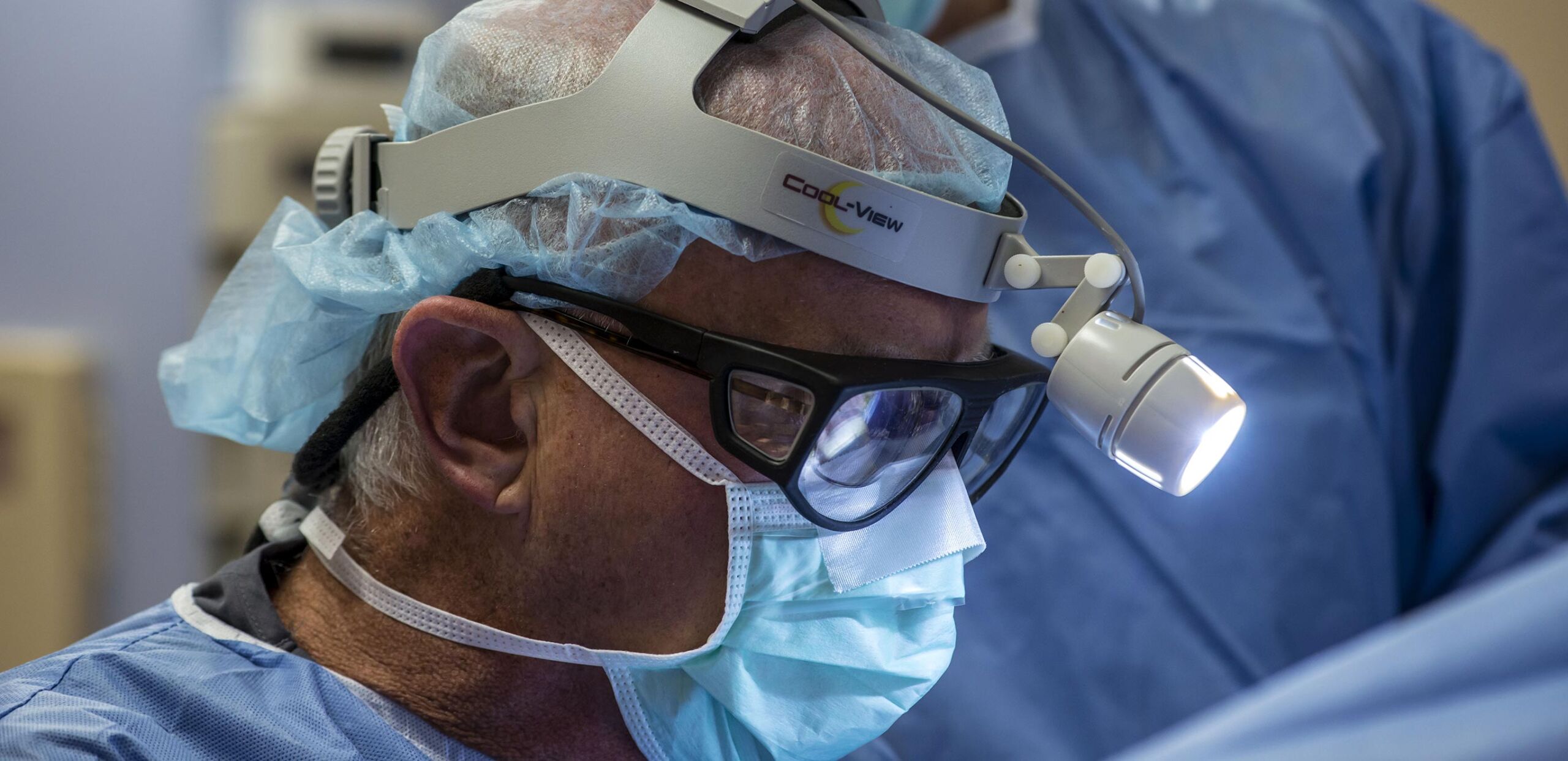 Cardiac surgeon James Kirchhoffer, MD, wears a headlamp while performing cardiac surgery, Cooley Dickinson Medical Group Hampshire Cardiovascular Associates, Northampton, MA 01060.