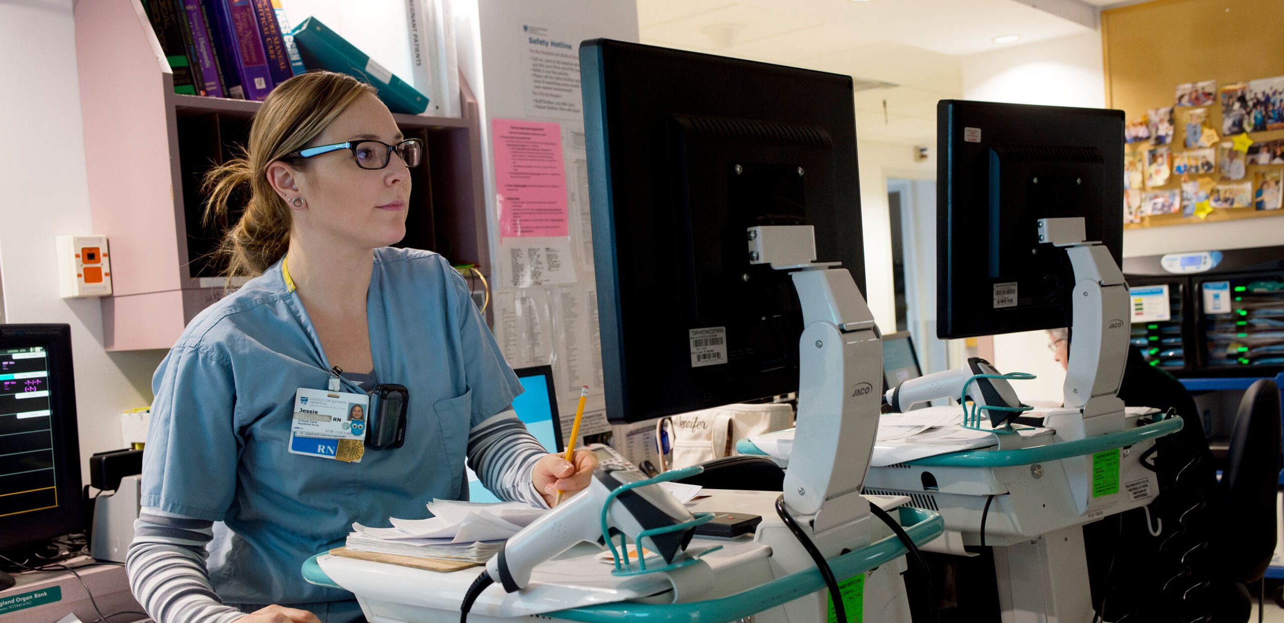 Provider reviews patient data on a computer screen, Quality and Patient Safety, Cooley Dickinson Hospital, 30 Locust Street, Northampton, MA 01060.