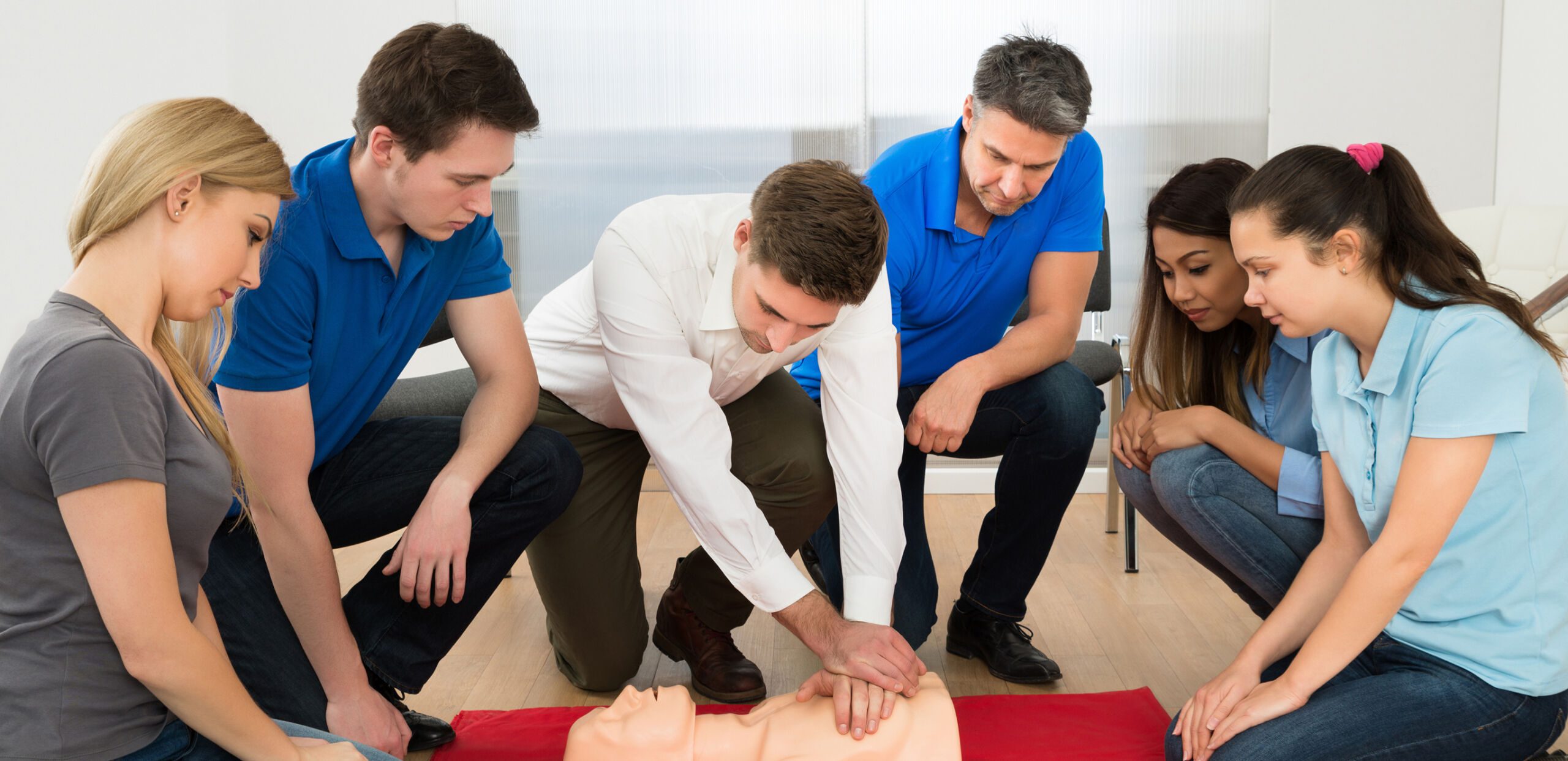 Male instructor demonstrating CPR on training dummy in Basic Life Support class, Cooley Dickinson Hospital, 30 Locust Street, Northampton, MA 01060.