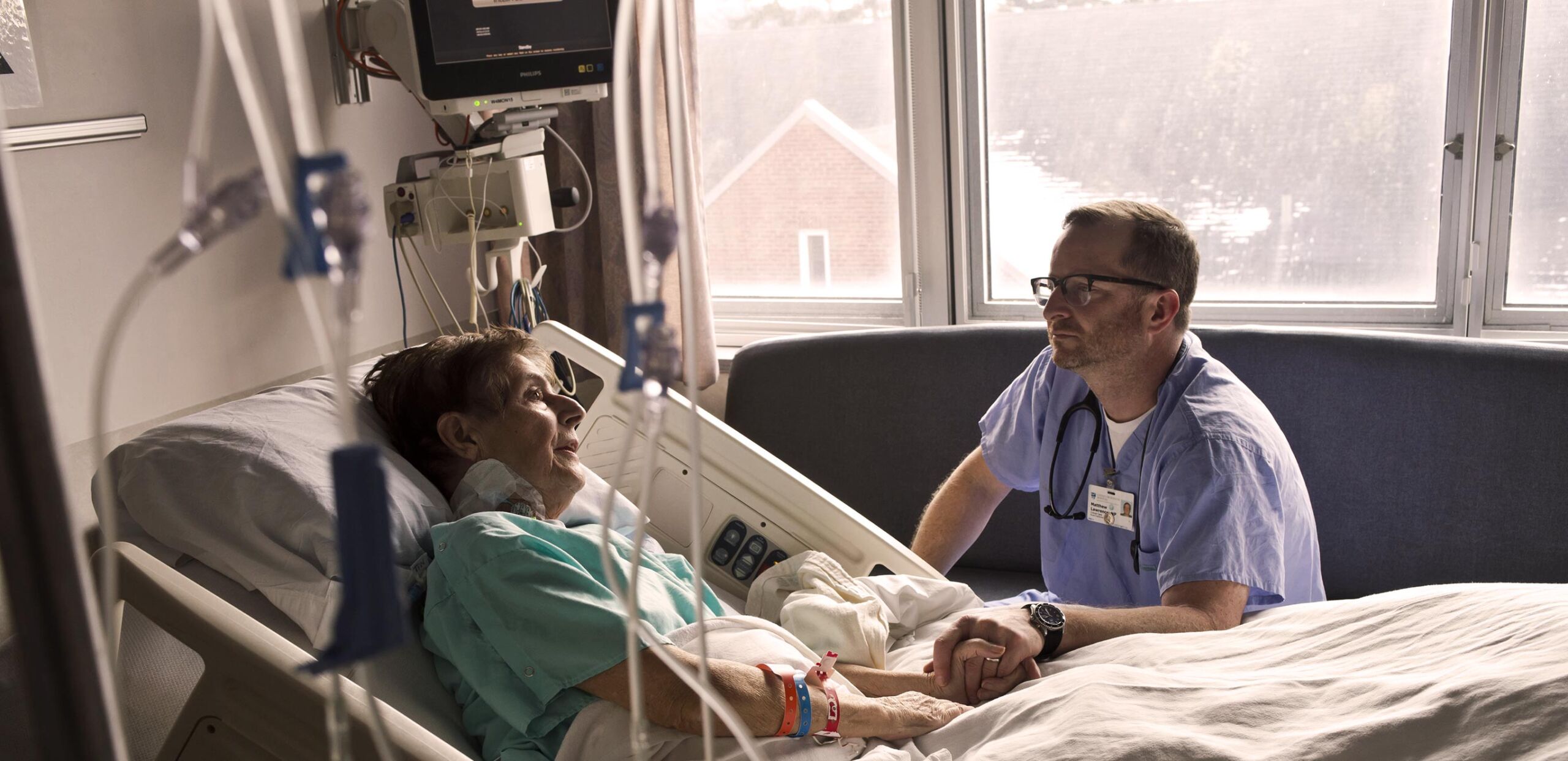 Critical care specialist Andrew Levinson, MD, talks with a patient in the Critical Care Unit at Cooley Dickinson Hospital, Northampton, MA 01060.