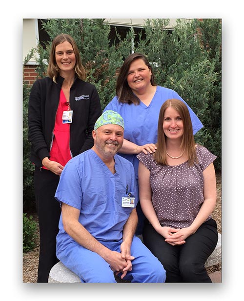 From left, Kim Gibowicz, RN, Holly Michaelson, MD, and John Noviello, CRNA, with Michelle Helms, MD. In March, Michelle had emergency surgery to fix a perforation in her small bowel. Her CDMG General Surgery partner, Holly Michaelson, performed the surgery and was assisted by anesthetist John Noviello. Kim Gibowicz was one of the nurses who took care of Michelle while she was a patient on North 3. “It’s one thing to take care of patients; it’s another thing to be a patient yourself,” said Michelle.