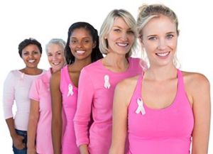 Five women wearing pink ribbons