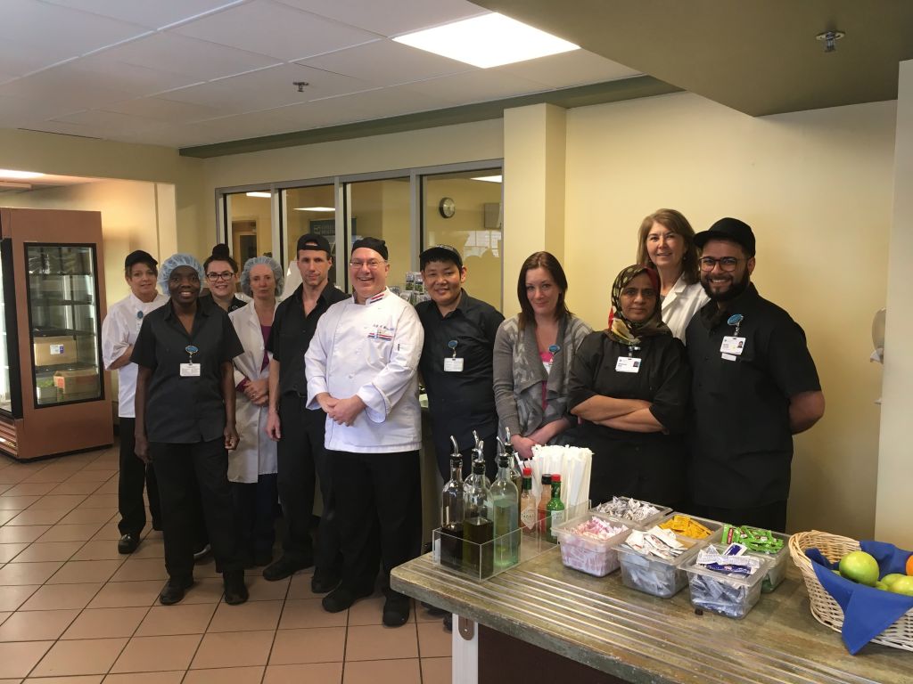 Gary Weiss, Executive Chef (Center), with members of the Cafeteria/Food & Nutrition Services team, pose for a photo recently.