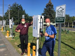 Cooley Dickinson Director of Support Services Tim Culhane and Facilities Director Jon Slater stand by the just-installed EV stations.