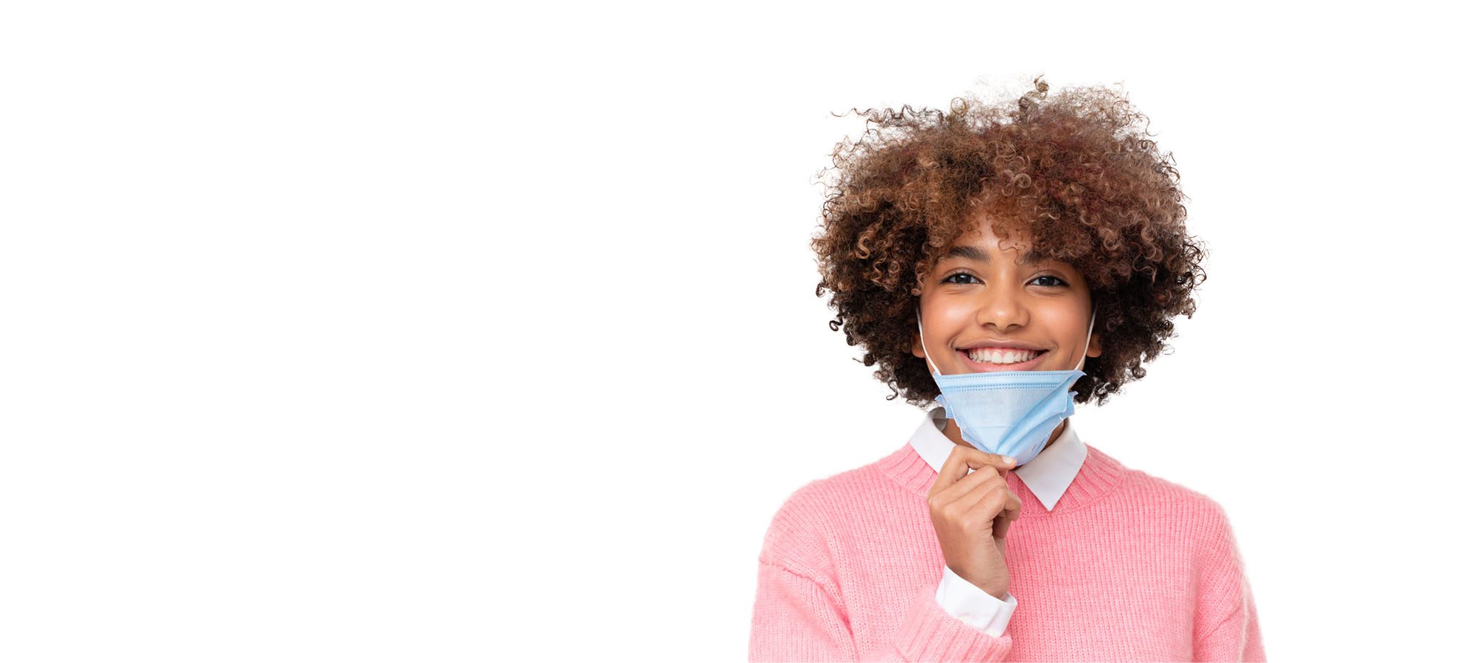 Girl removing surgical mask and smiling