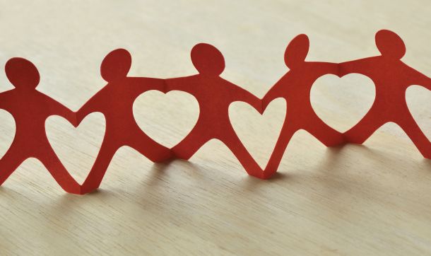 Paper dolls holding hands