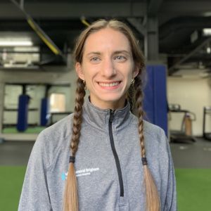 Natalie standing in the Wellness and Sports Performance Center gym